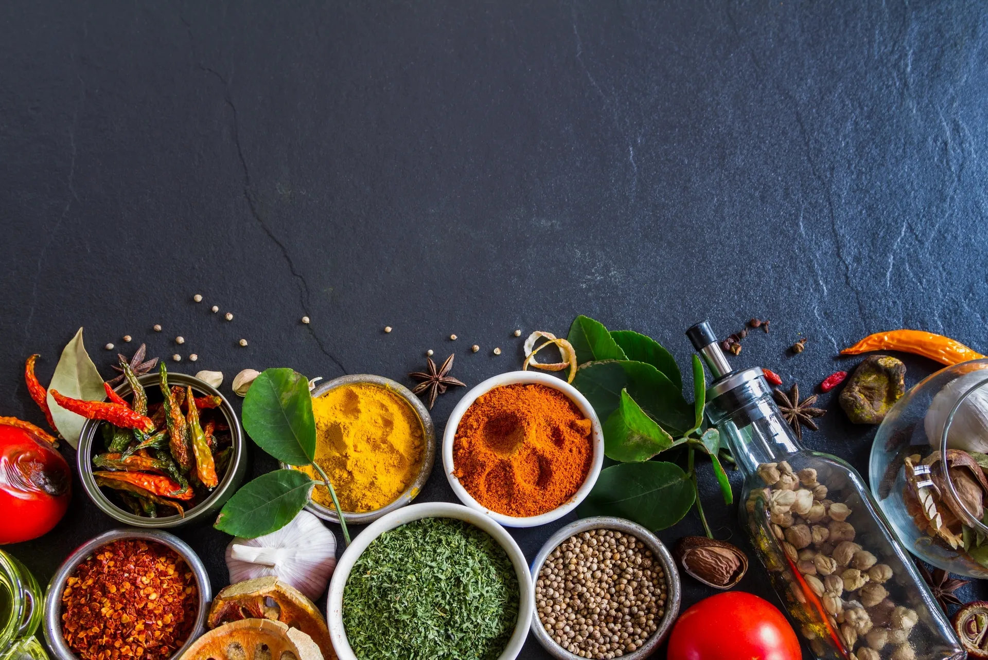 Indian spices, chillies, and fresh curry leaves