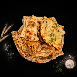 Bread basket ( plain naan, onion kulcha, tandoori roti, garlic naan )